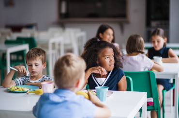 a-group-of-cheerful-small-school-kids-in-canteen-e-GE6JMQN.png